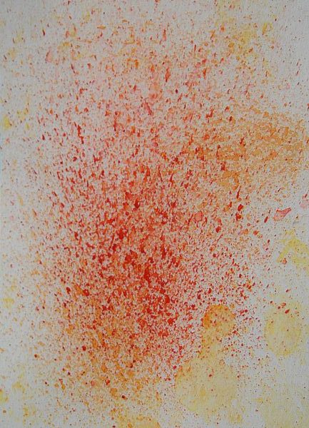 A gray piece of paper with red and yellow splattered on it. abstract watercolor